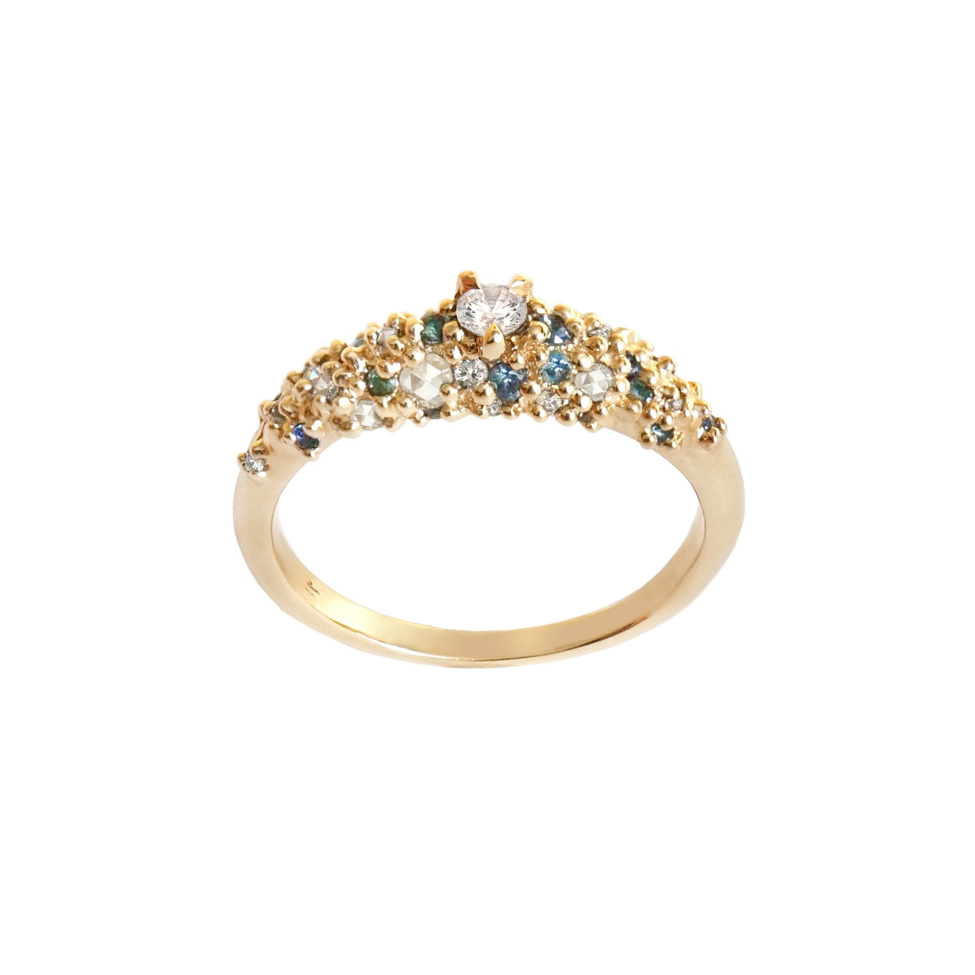 A product photo of Laurie Fleming Jewellery's "Blue-Green Sapphire and Diamond Mix Moss Signet Ring," a bold solid gold signet-style ring encrusted with varying shades and sizes of blue-green teal sapphires, round brilliant cut diamonds, and rose cut diamonds on the band. The ring is on a white background.