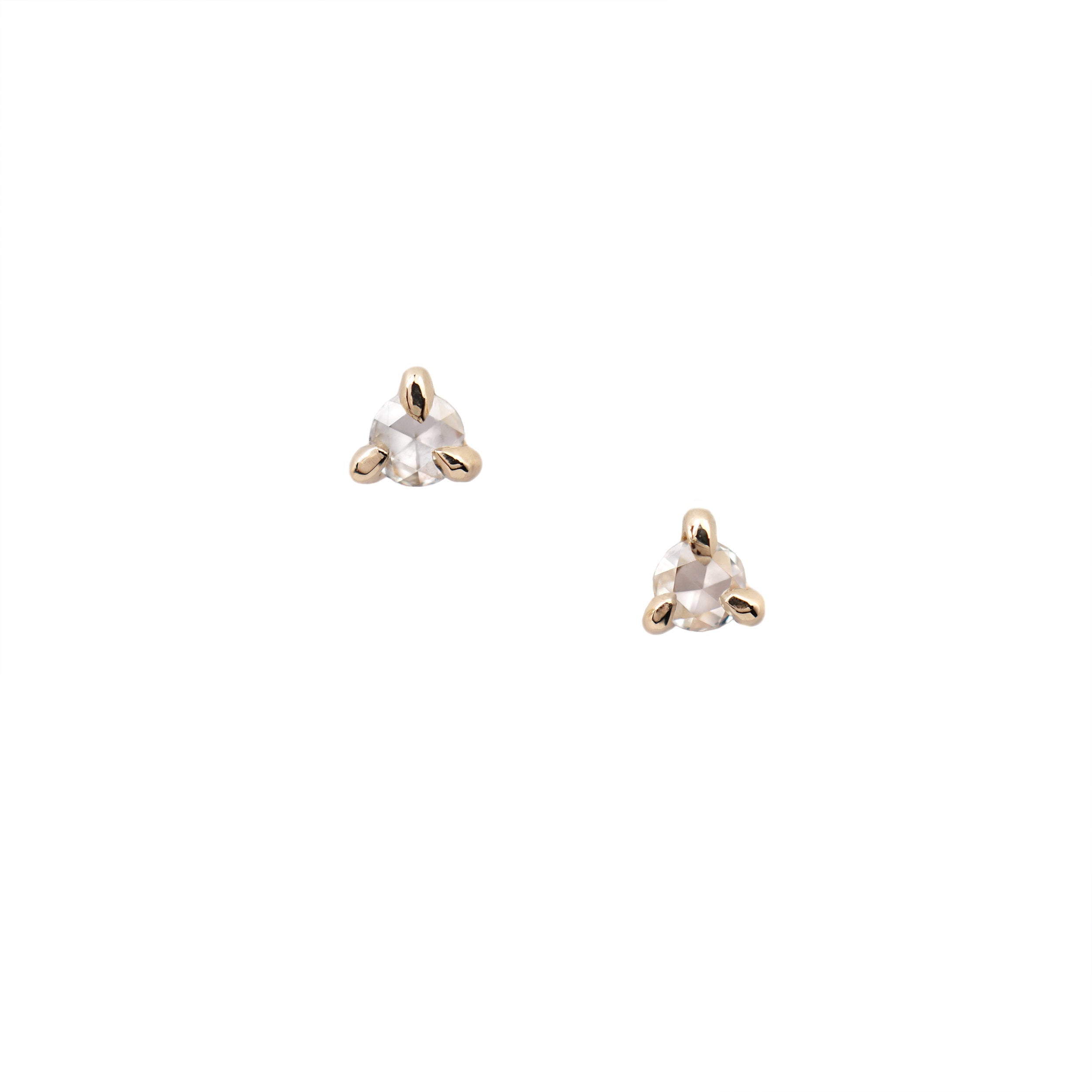 Product photo of the Selene Stud earring, which feature a rose cut diamond held by three claw shaped prongs. The earrings are against a white background.