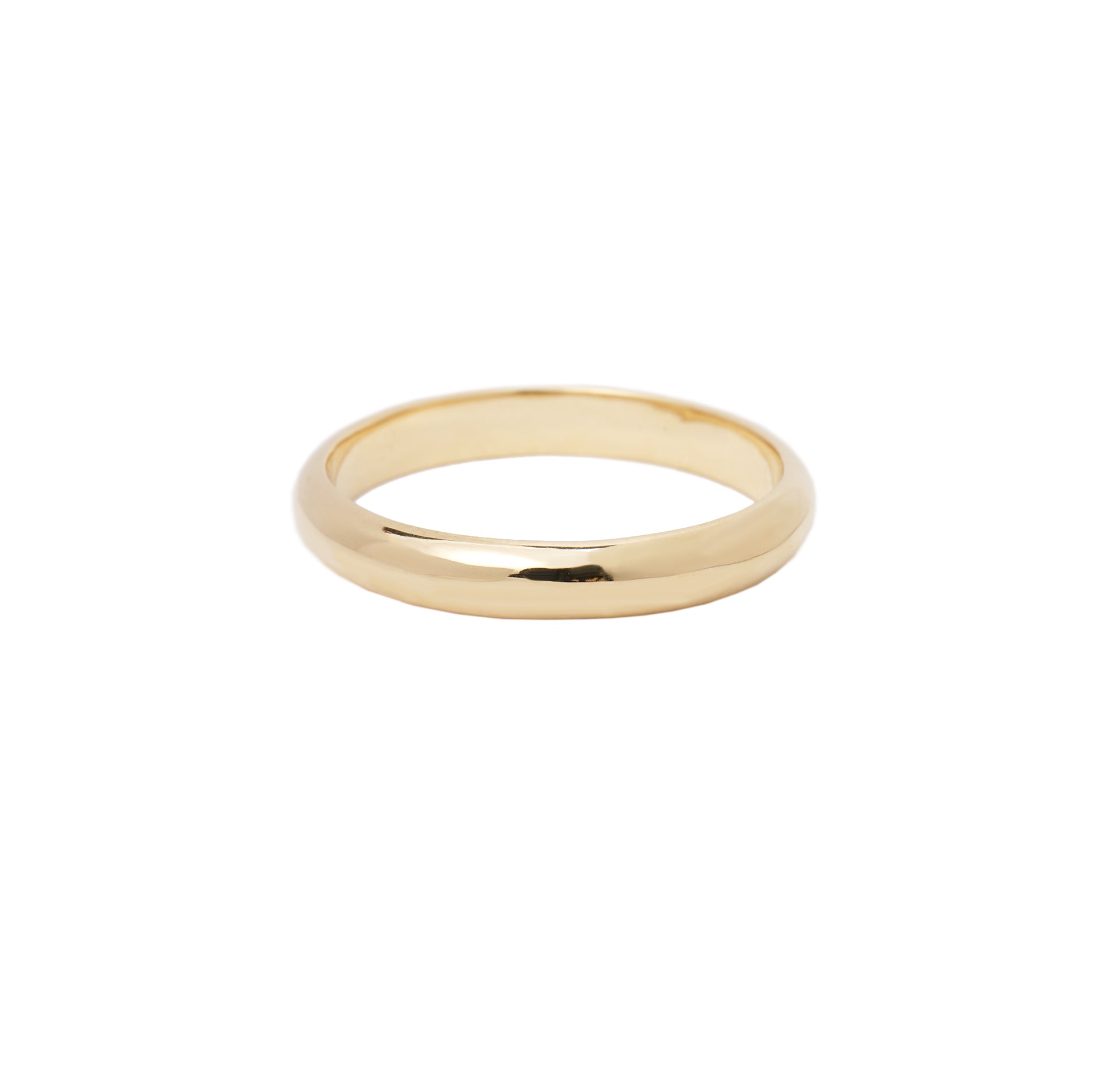 A stock photo of Laurie Fleming Jewellery's plain solid gold "Oak" band, a 3.5mm wide half round stacking ring/wedding band, handmade in Toronto. The ring is on a white background.