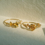 Two Asrai Garden Rings. Left: Sleeping Petal Band, Dahlia, Calla Lily, Diamond Dewdrops, Hidden Fairy. Right: Sleeping Petal Band, Peonies, Lilacs - Laurie Fleming Jewellery