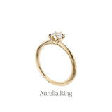 The Aurelia style engagement ring by Laurie Fleming Jewellery, featuring a smooth comfortable tapered gold band.