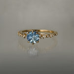 One of a kind Nereid ring featuring a round John Dyer Starbrite cut light blue sapphire centre - Laurie Fleming Jewellery