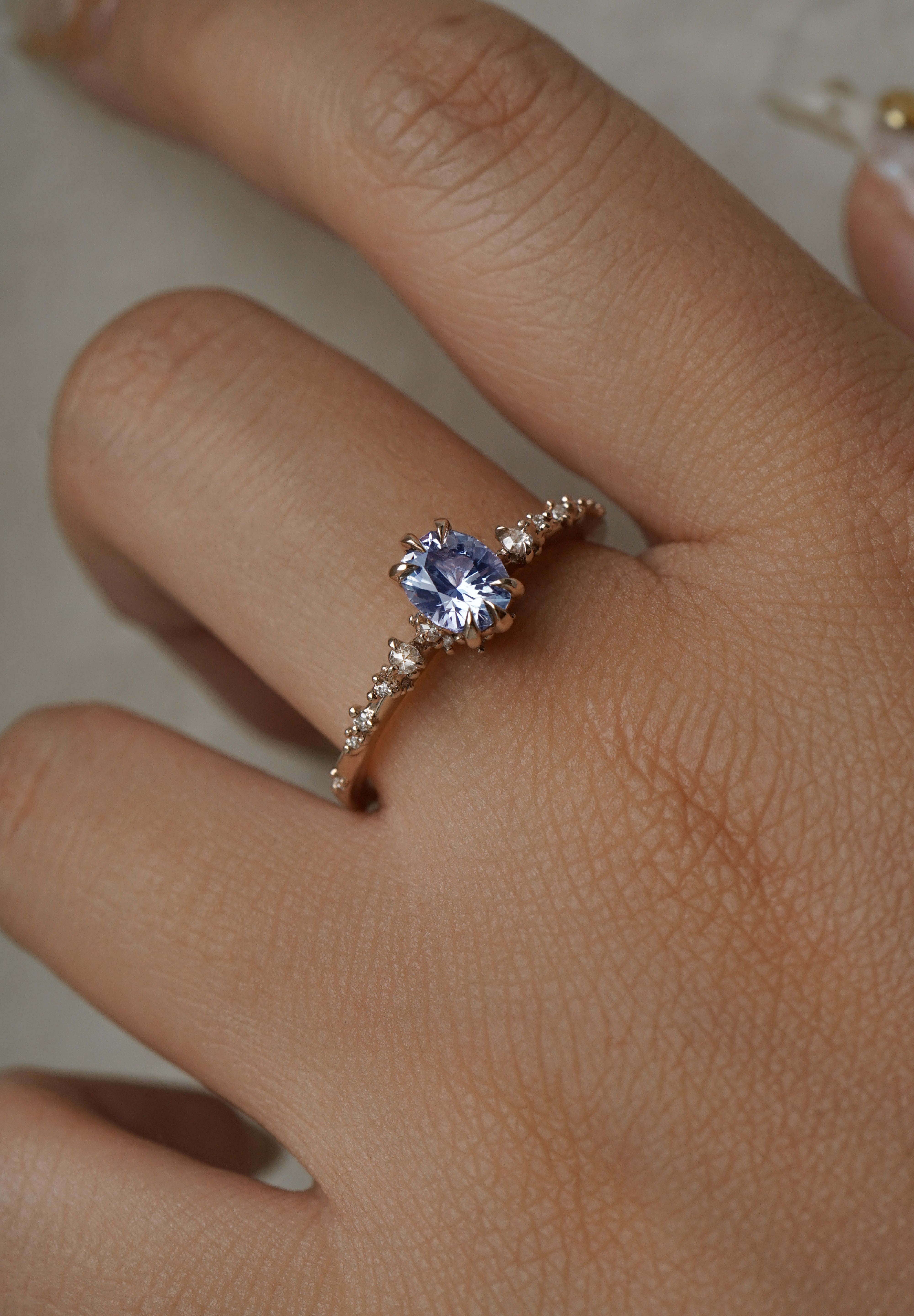 One of a kind Nereid ring featuring an oval artist cut light blue-violet sapphire centre - Laurie Fleming Jewellery