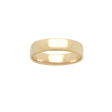 A stock photo of Laurie Fleming Jewellery's plain solid gold "Juniper" band, a 5mm wide flat comfort fit stacking ring/wedding band, handmade in Toronto. The ring is on a white background.