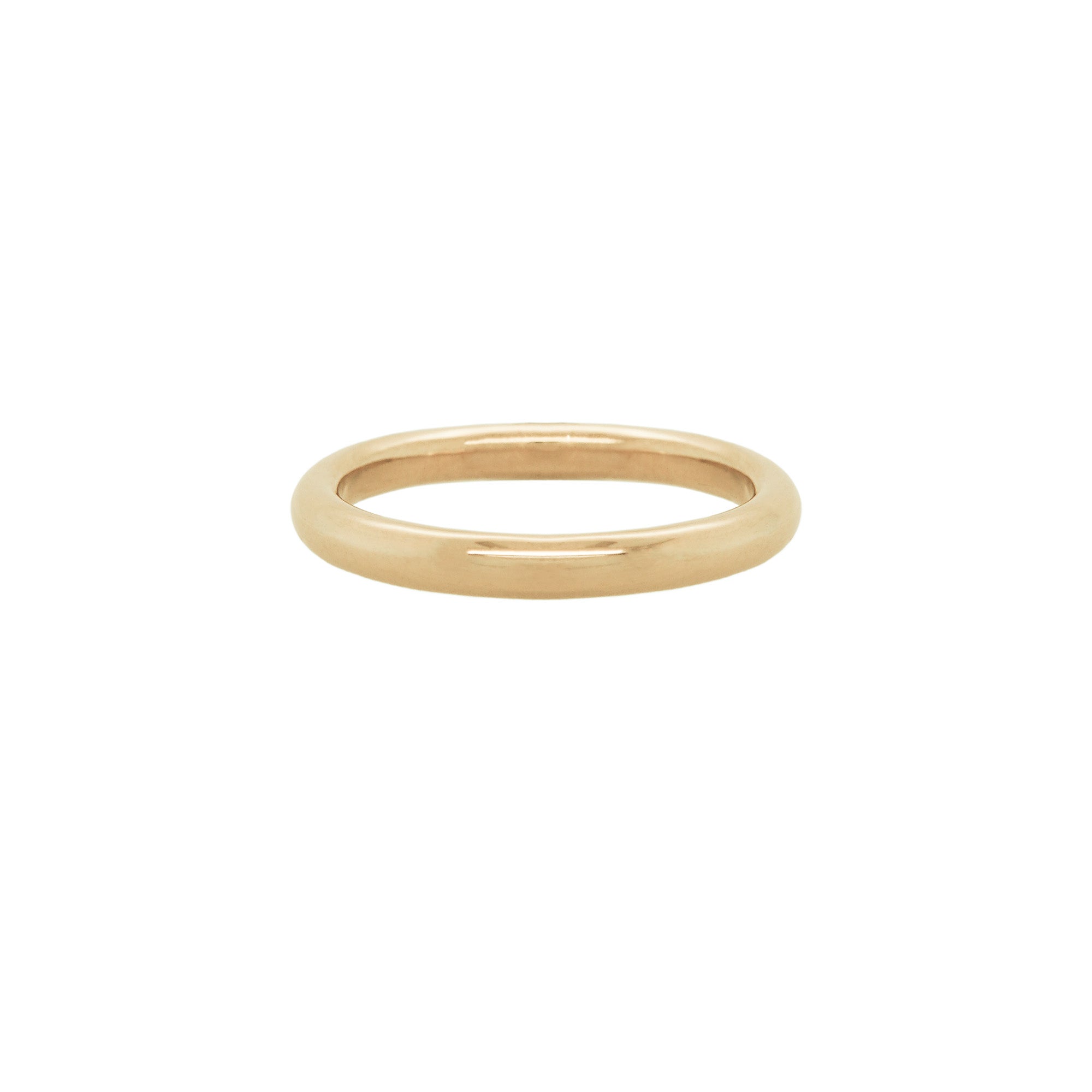 A stock photo of Laurie Fleming Jewellery's plain solid gold "Peach" band, a 2.1mm wide round wire stacking ring/wedding band, handmade in Toronto. The ring is on a white background.