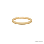 A stock photo of Laurie Fleming Jewellery's plain solid gold "Peach" band, a 2.1mm wide round wire stacking ring/wedding band, handmade in Toronto. The ring has a soft satin brushed finish and is on a white background.