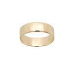 A stock photo of Laurie Fleming Jewellery's plain solid gold "Rowan" band, a 6mm wide flat comfort fit stacking ring/wedding band, handmade in Toronto. The ring is on a white background.