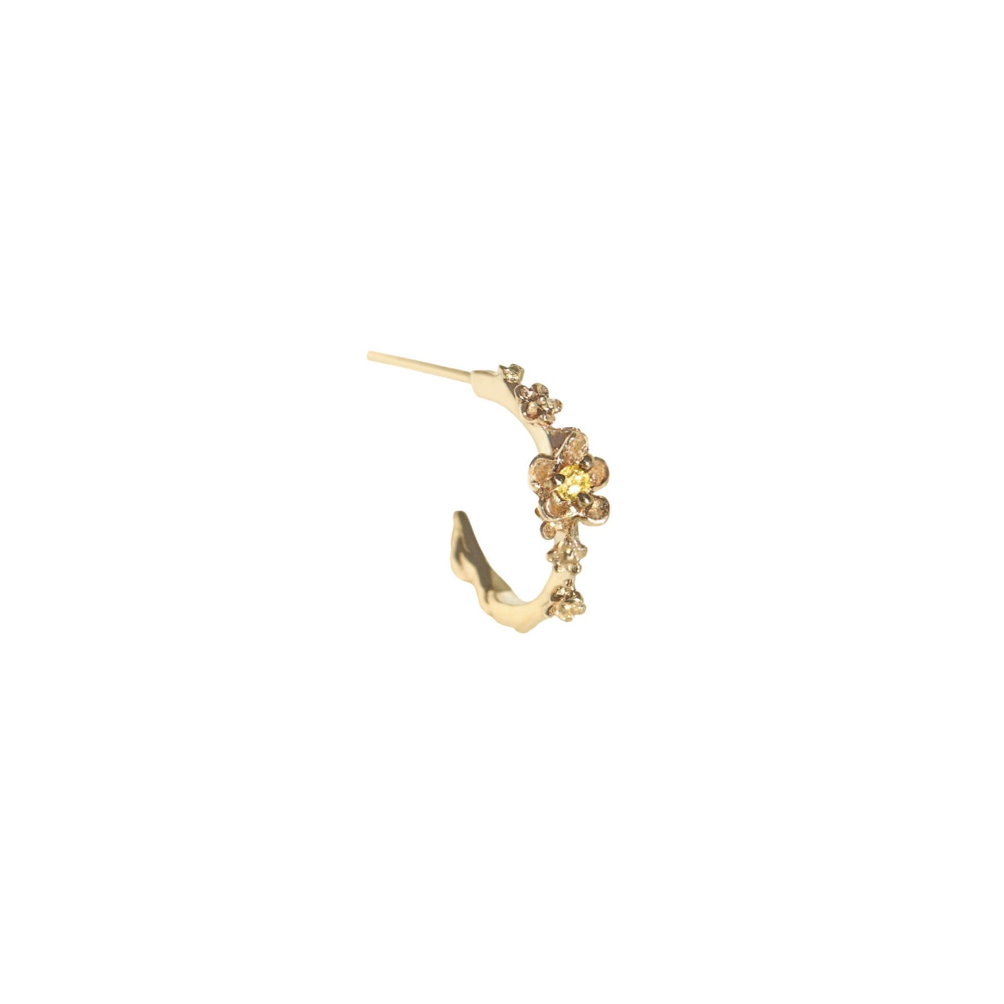 Laurie Fleming Jewellery "Small Buttercup Hoop" earring, featuring petite hand-carved buttercup flowers with a yellow sapphire centre. The earring is on a white background.