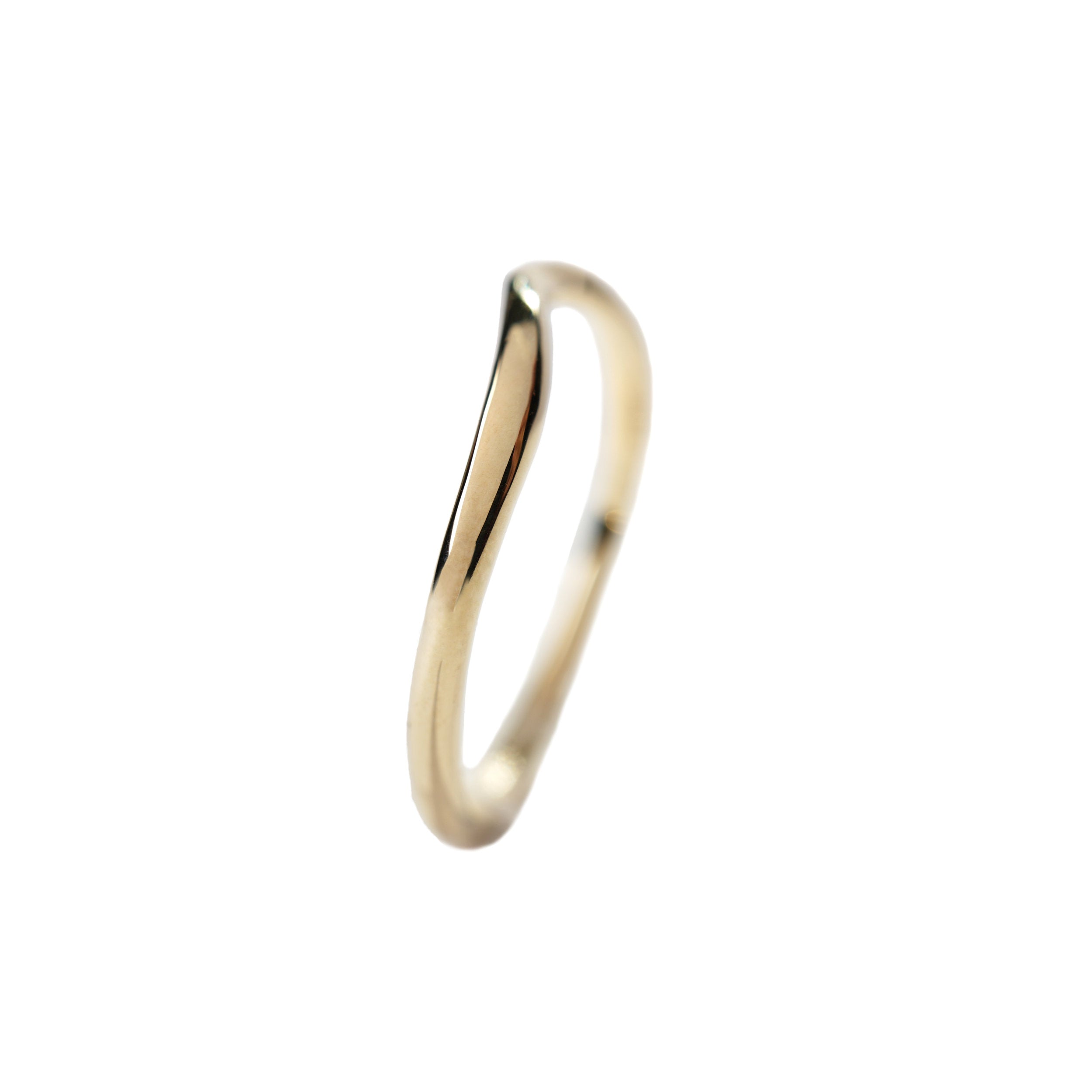 A photo of the Undine Ring from the side to show its gently curved band on a white background.