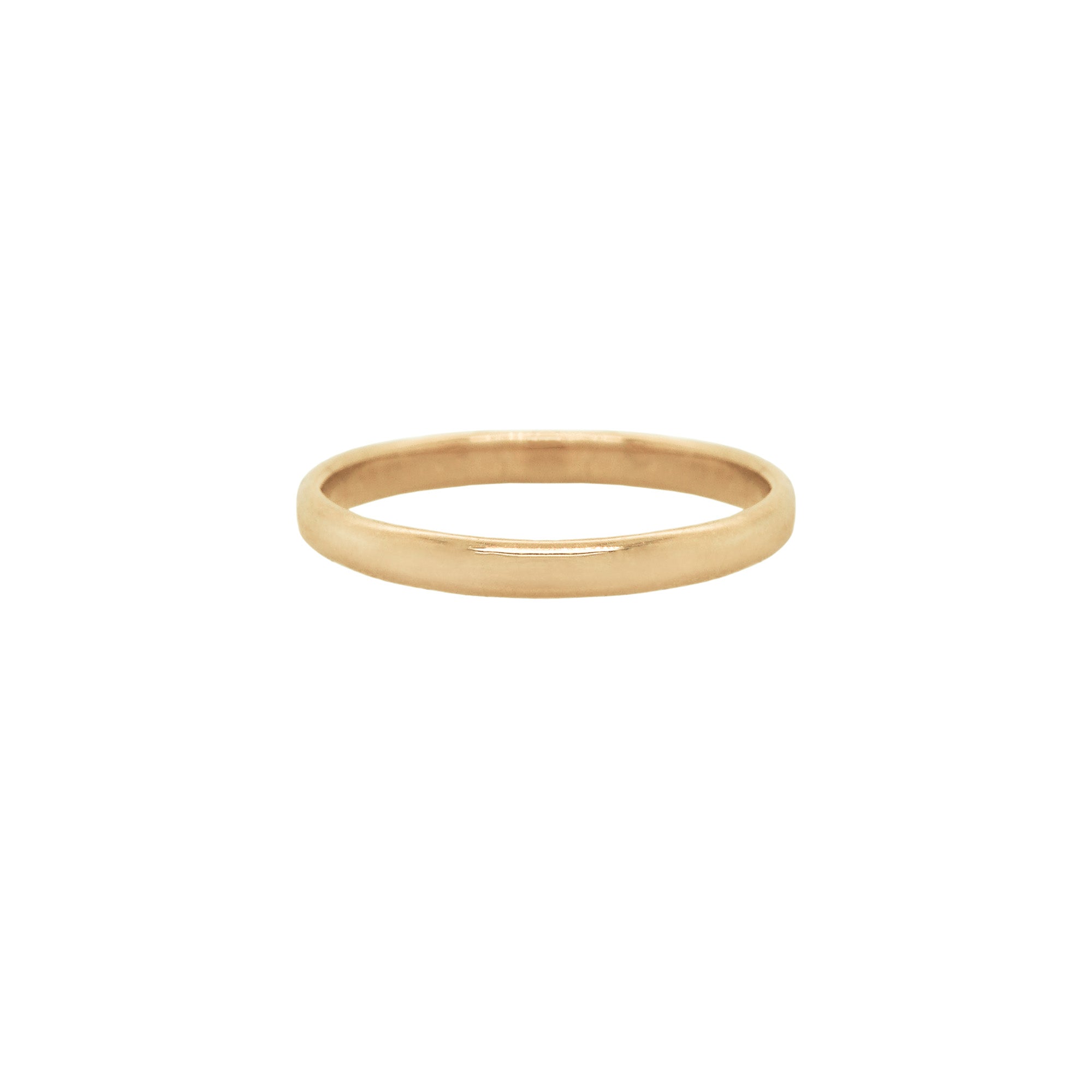 A stock photo of Laurie Fleming Jewellery's plain solid gold "Wisteria" band, a 2mm wide stacking ring/wedding band, handmade in Toronto. The ring is on a white background.