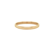 A stock photo of Laurie Fleming Jewellery's plain solid gold "Wisteria" band, a 2mm wide stacking ring/wedding band, handmade in Toronto. The ring is on a white background.