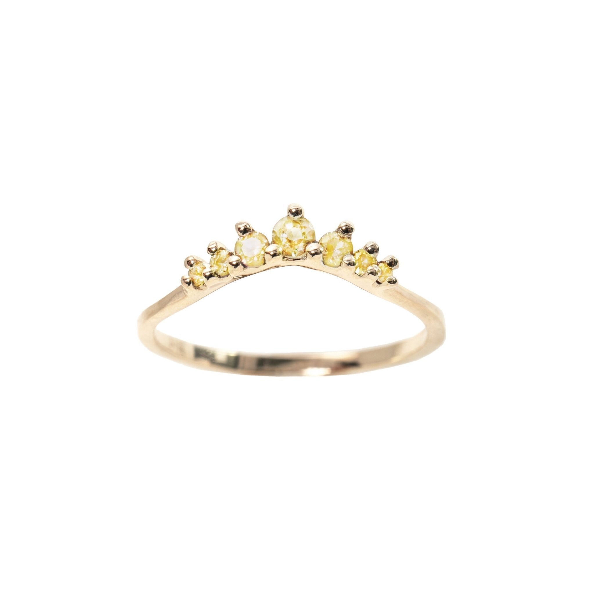 A product photo of Laurie Fleming Jewellery's Yellow Sapphire Beacen Ring, a solid gold hand carved contour band featuring tapered yellow sapphires.