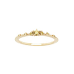 Laurie Fleming Jewellery's "Yellow Sapphire Water Lily Ring," a delicate solid gold stacking ring with yellow sapphires scattered along the band. The ring is on a white background.