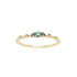 A product photo of Laurie Fleming Jewellery's "Sapphire Water Lily Ring," a delicate solid gold stacking ring with blue-green teal sapphires scattered along the band. The ring is on a white background.